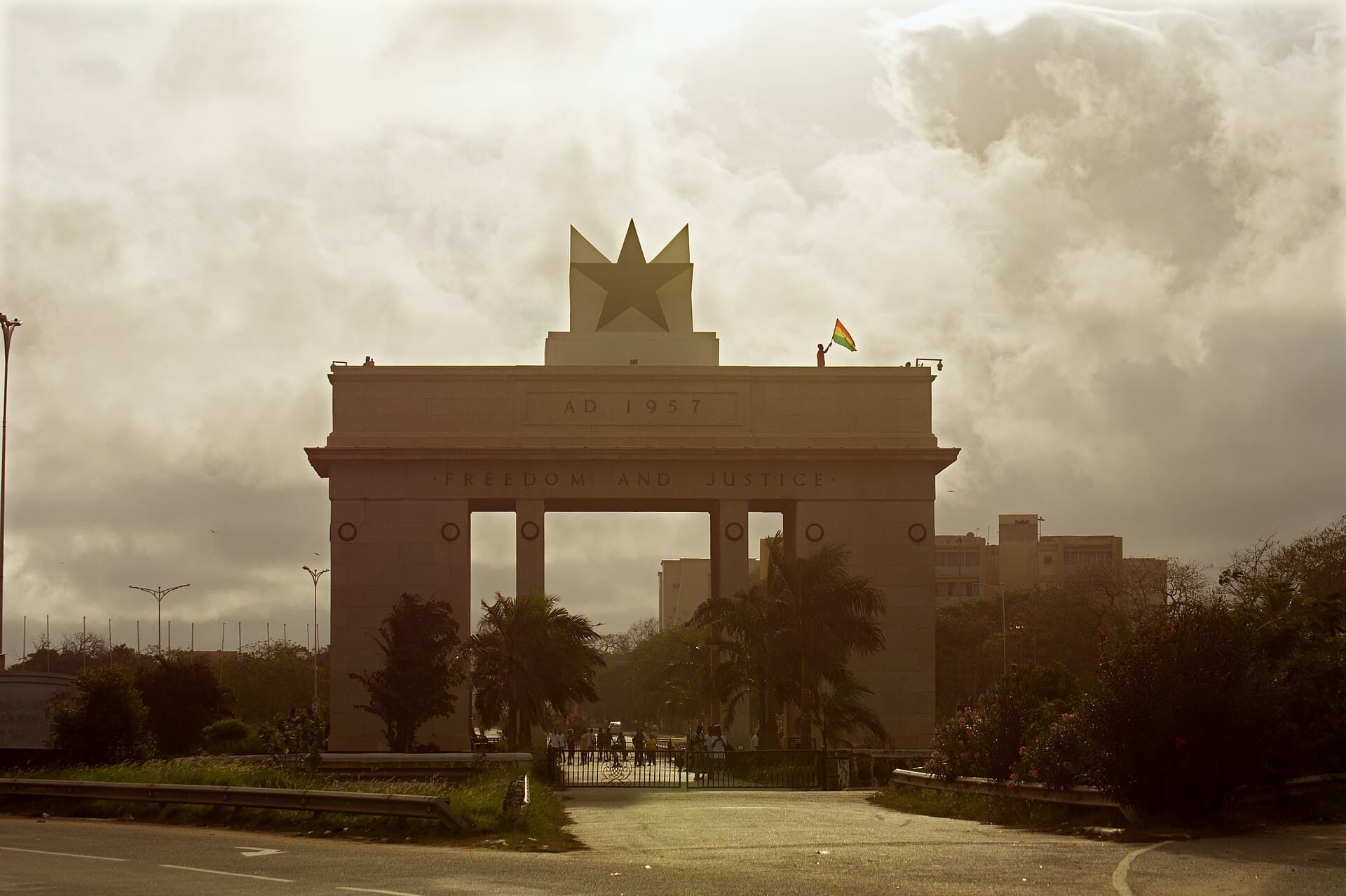 Independence Arch in Accra glowing at sunset